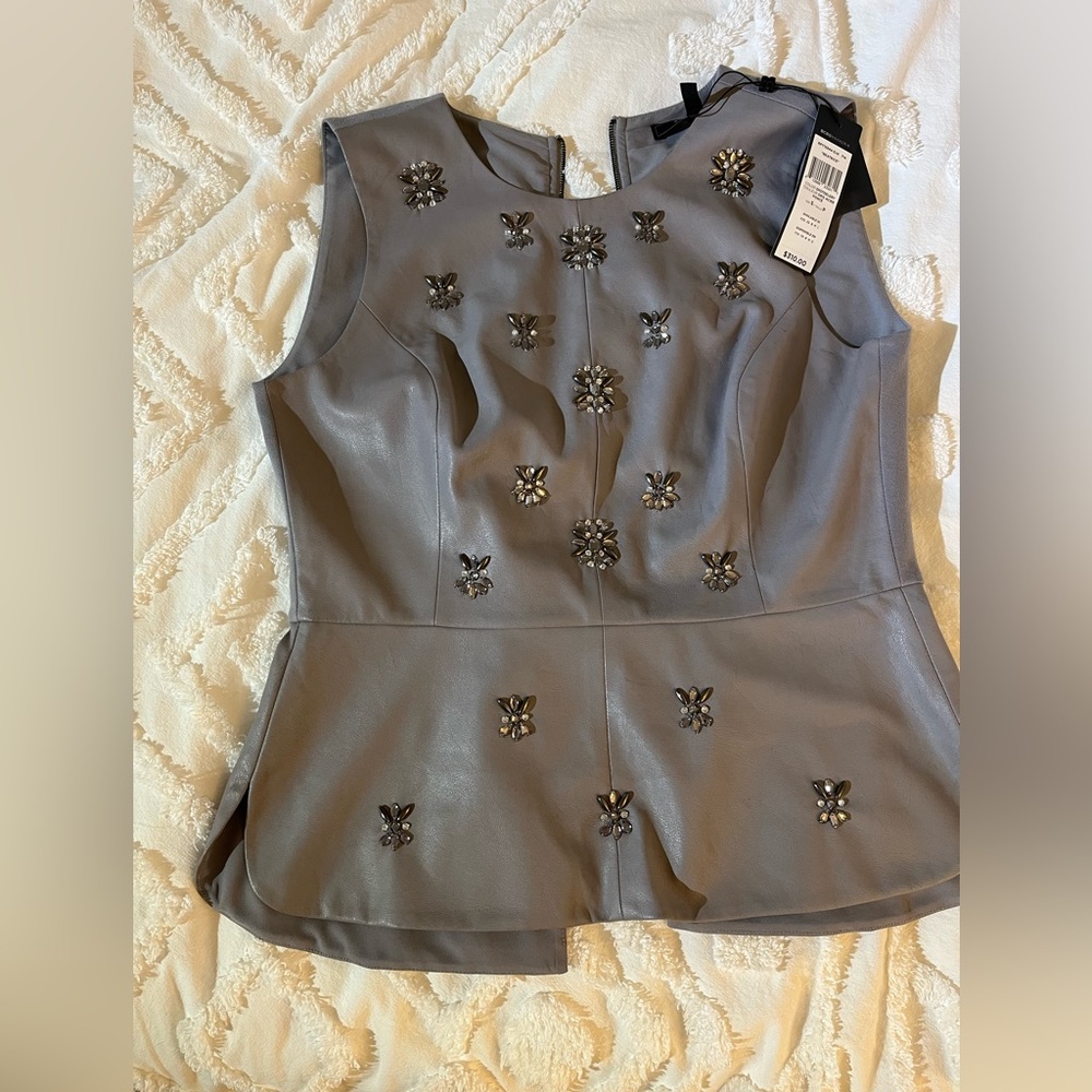 “Beatrice” size small BCBG never worn peplum top. So flattering!